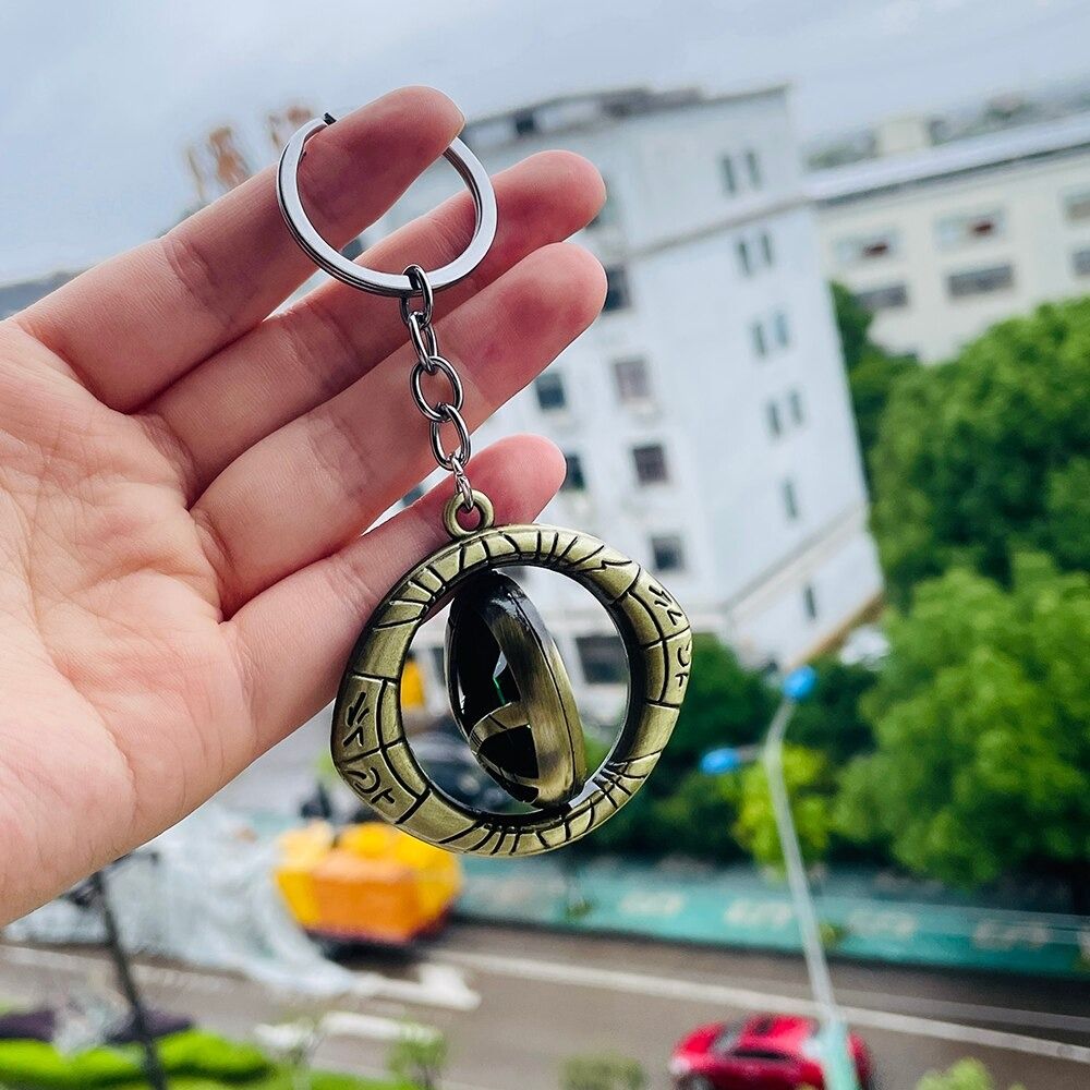 Marvel Avengers Doctor Strange Eye Pendant Keyring The Time Stone Metal Keychain Turnable Avengers Backpack Pendant Accessories Birthday Gift - Oshi.pk - Buy & Sell Online