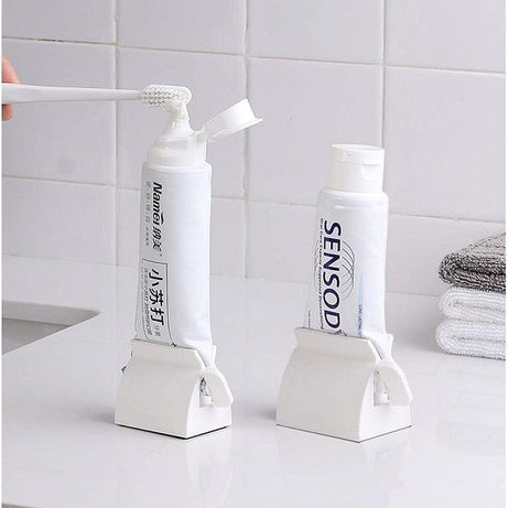 Rolling Tube Toothpaste Holder Stand Bathroom Organizer - Oshi.pk - Buy & Sell Online