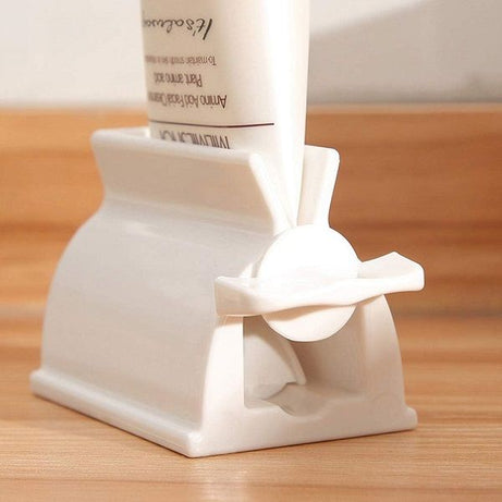 Rolling Tube Toothpaste Holder Stand Bathroom Organizer - Oshi.pk - Buy & Sell Online