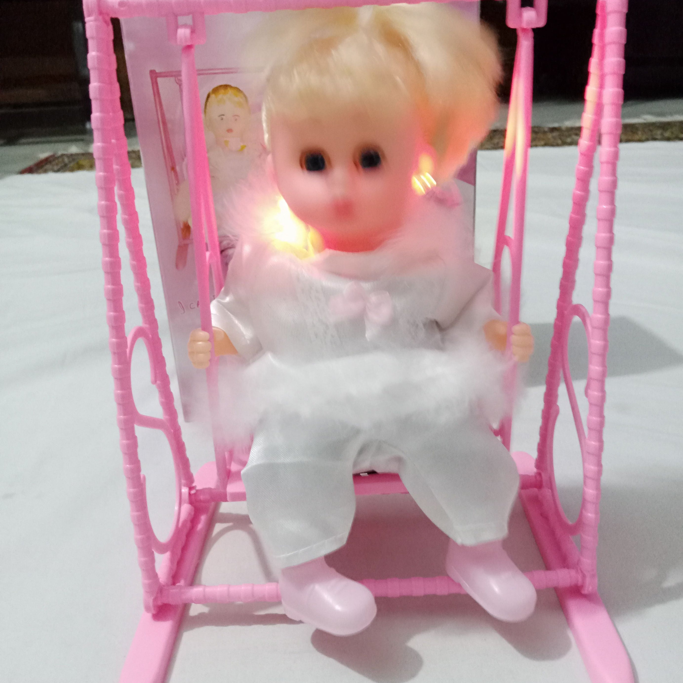 Swinging Doll - Battery operated - Music with Swing